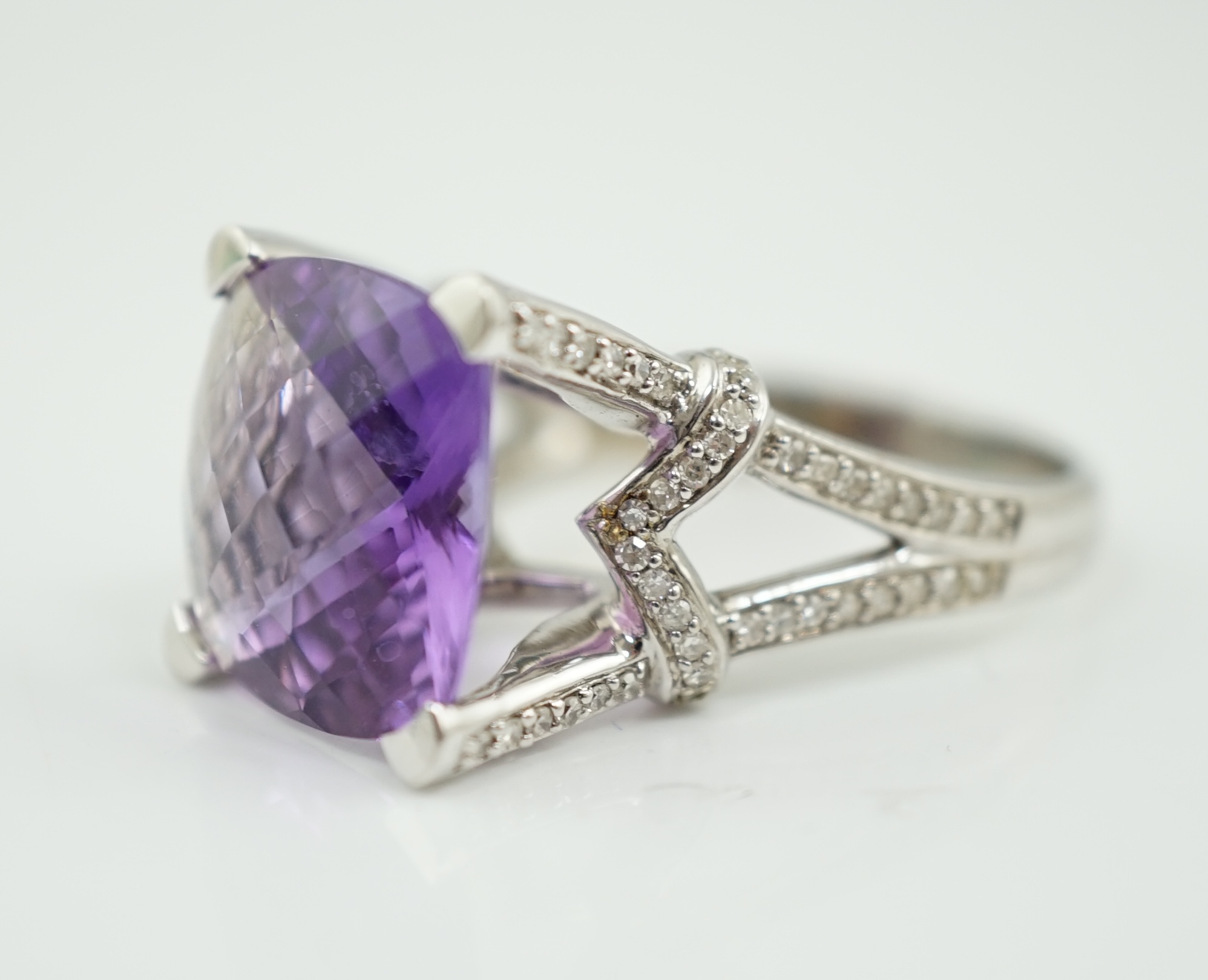 A modern 14k white gold and single stone fancy cushion cut amethyst dress ring